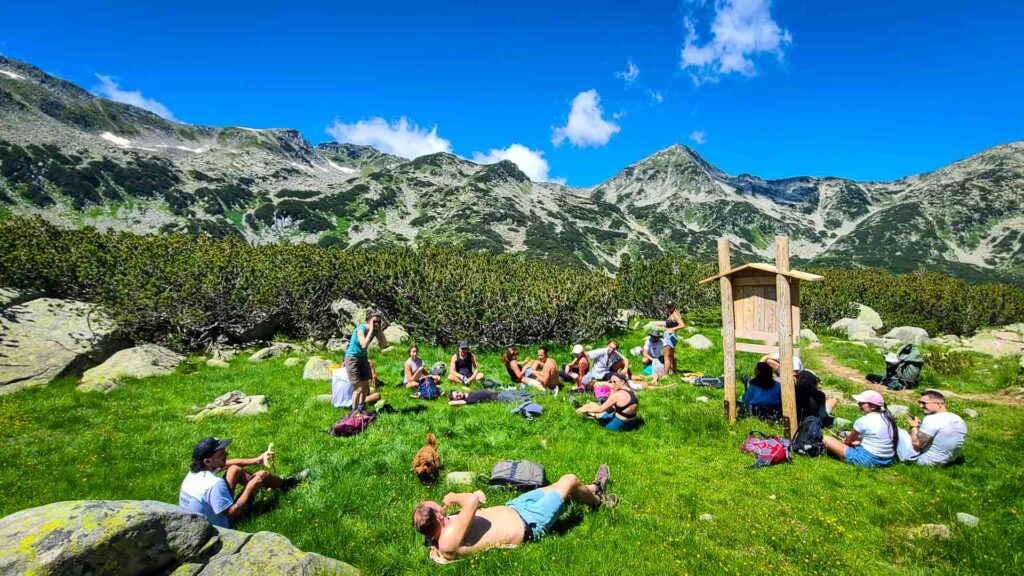 A group hike in Bansko, Bulgaria with a beautiful blue sky