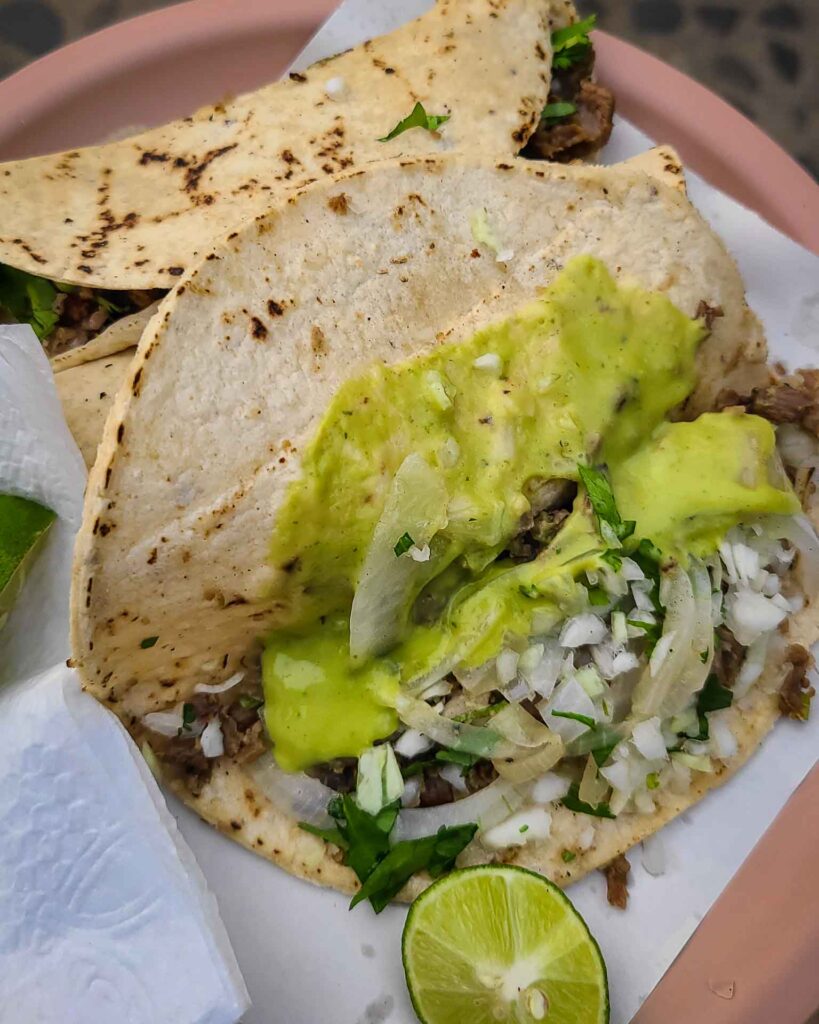 Cheap street tacos with green sauce