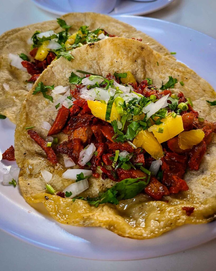 tacos al pastor (pork marinated in chili and achiote paste)