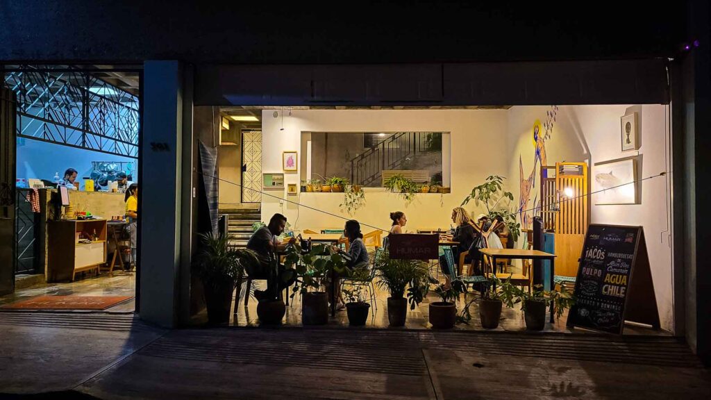 Picture of people eating at a restaurant from the street in Oaxaca Mexico